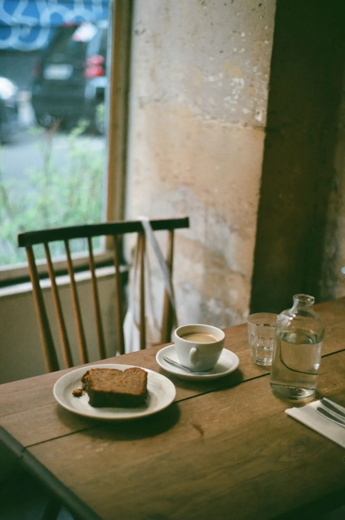 Coffee and cake at a cafe table